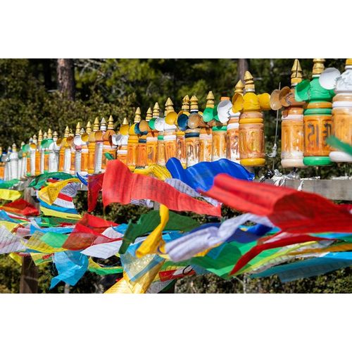 Bhutan-Paro Colorful prayer wheels and flags along the hiking trail to the Tigers Nest Monastery